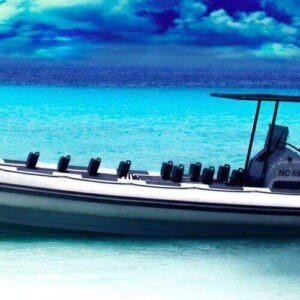 The Powerboat - speedboat - boat tour: 30 minute fun trip features a white inflatable powerboat with twin outboards, shaded seats, and a black canopy—ideal for enjoying calm turquoise waters under dramatic skies.