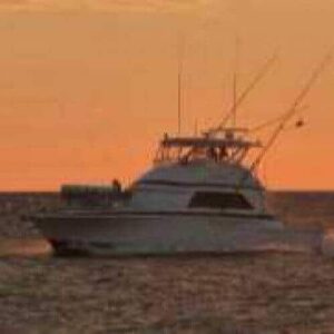 Experience the serene beauty of Curacao with Sunset Boat Tours Curacao—glide across calm waters at sunset as orange skies reflect on the sea, creating a peaceful scene ideal for unforgettable evening cruises.